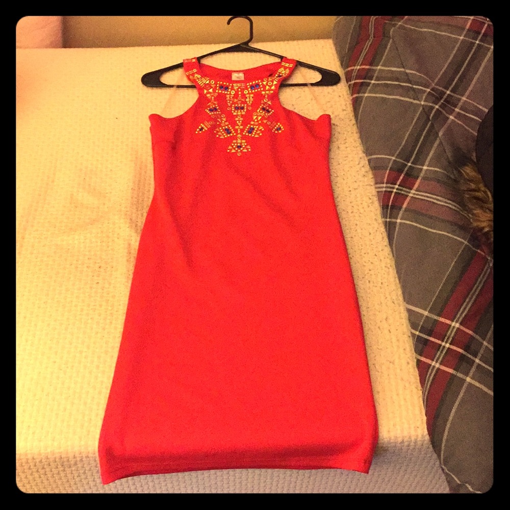 Red bodycon dress with studded design.